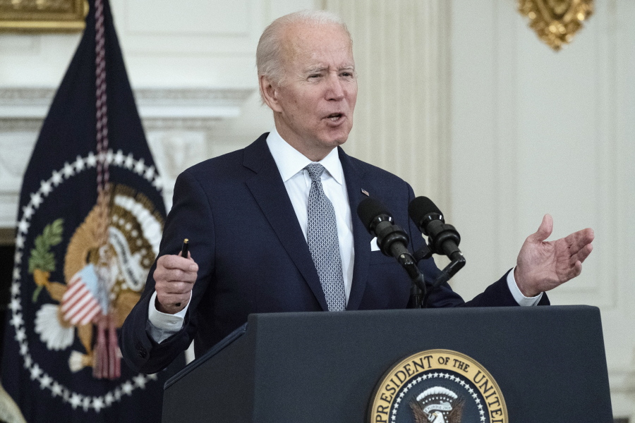 President Joe Biden speaks about the 2021 jobs report in the State Dining Room of the White House, Friday, Jan. 7, 2022, in Washington.