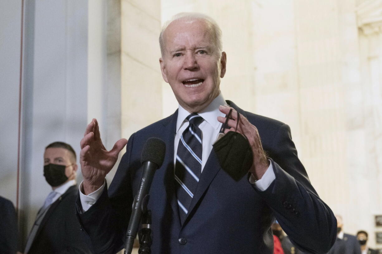 President Joe Biden speaks to the media after meeting privately with Senate Democrats, Thursday, Jan. 13, 2022, on Capitol Hill in Washington.