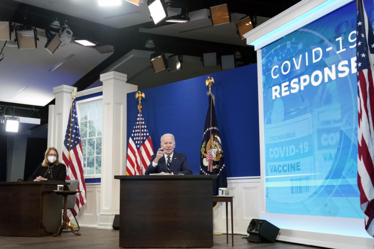 President Joe Biden, accompanied by FEMA administrator Deanne Criswell, speaks about the government's COVID-19 response, in the South Court Auditorium in the Eisenhower Executive Office Building on the White House Campus in Washington, Thursday, Jan. 13, 2022.
