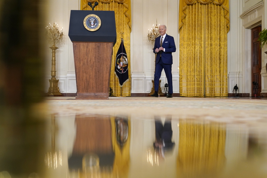 President Joe Biden arrives to speaks at a news conference in the East Room of the White House in Washington, Wednesday, Jan. 19, 2022.