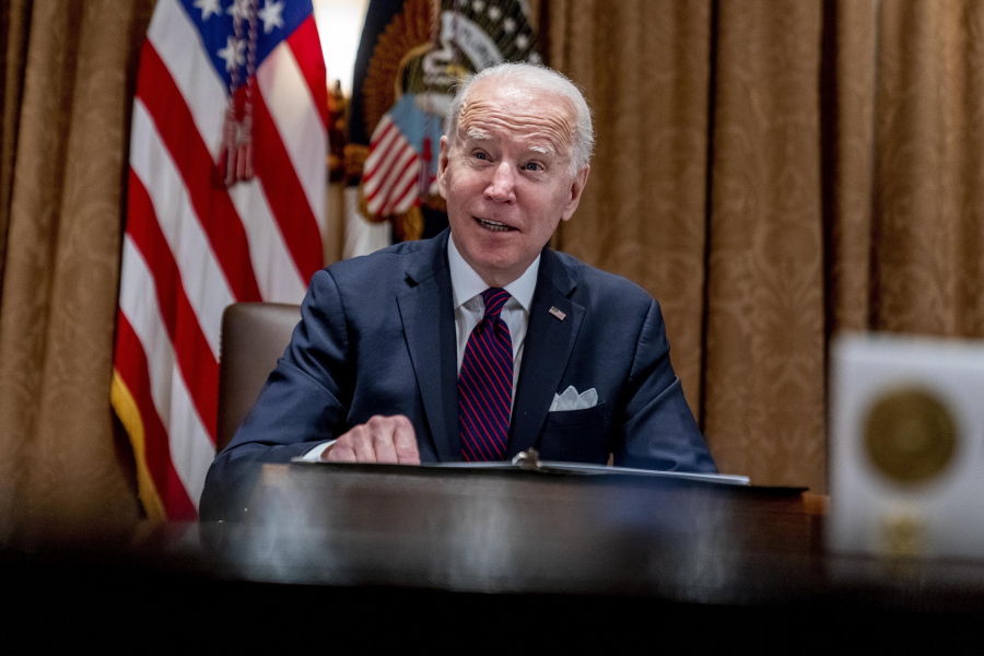President Joe Biden meets with members of the Infrastructure Implementation Task Force to discuss the Bipartisan Infrastructure Law, in the Cabinet Room at the White House in Washington, Thursday, Jan. 20, 2022.