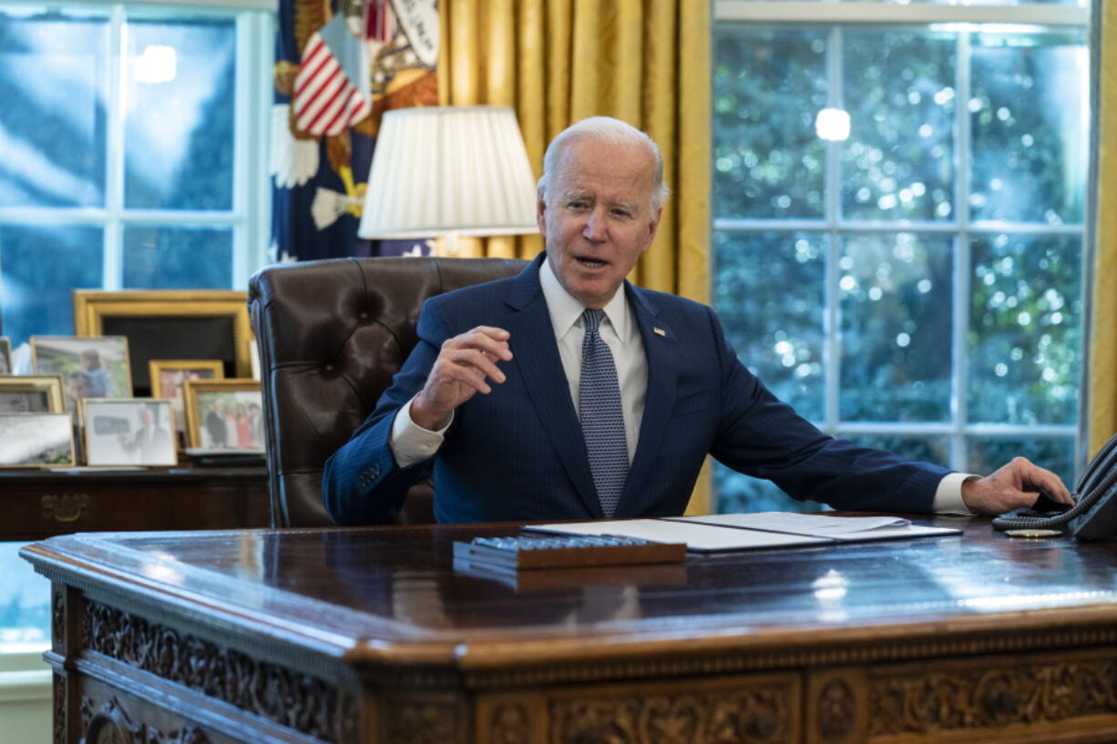 FILE - President Joe Biden speaks before signing an executive order to improve government services, in the Oval Office of the White House, Dec. 13, 2021, in Washington. Biden's long arc in public life has always had one final ambition: to sit behind the Resolute Desk of the Oval Office. He achieved it, albeit at 78 the oldest person to assume the presidency.