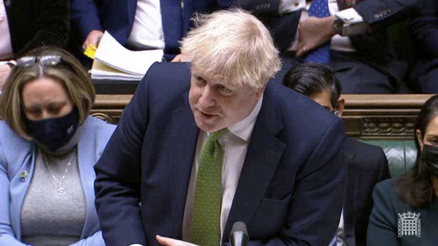 In this screen shot taken from video, Britain's Prime Minister Boris Johnson speaks during Prime Minister's Questions in the House of Commons, London, Wednesday, Jan. 19, 2022.  Johnson faced a grilling from opponents in Parliament as well as a threat from his own party's lawmakers over a string of lockdown-flouting government parties. Conservative legislators are judging whether to trigger a no-confidence vote in Johnson over the "partygate" scandal. Johnson and loyal ministers are trying to bring rebels back into line before they submit letters to a party committee calling for the vote.