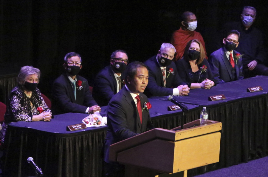 Mayor Sokhary Chau addresses the assembly during the Lowell City Council swearing-in ceremony, Monday, Jan. 3, 2022, in Lowell, Mass., held at Lowell Memorial Auditorium due to the COVID-19 pandemic. Chau, a refugee who survived the Khmer Rouge's bloody regime, has become the city's first mayor of color and the first Cambodian American mayor in the United States.