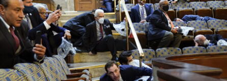 FILE - Members of Congress shelter in the House gallery as rioters try to break into the House Chamber at the U.S. Capitol on Jan. 6, 2021, in Washington.