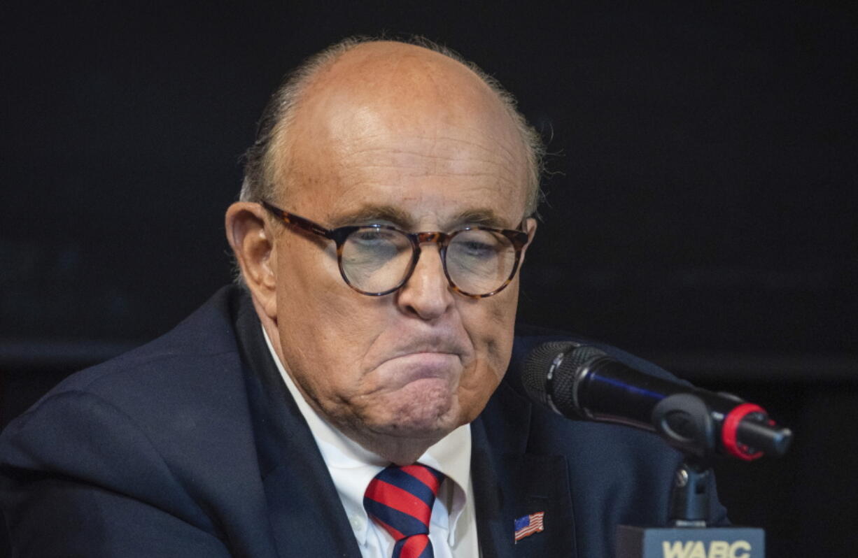 FILE - Former New York City Mayor Rudy Giuliani reacts during a talk radio show at the WABC studios in New York Sept. 10, 2021.  The House committee investigating the Capitol insurrection has issued subpoenas to some of Donald Trump's closest advisers, including Rudy Giuliani.