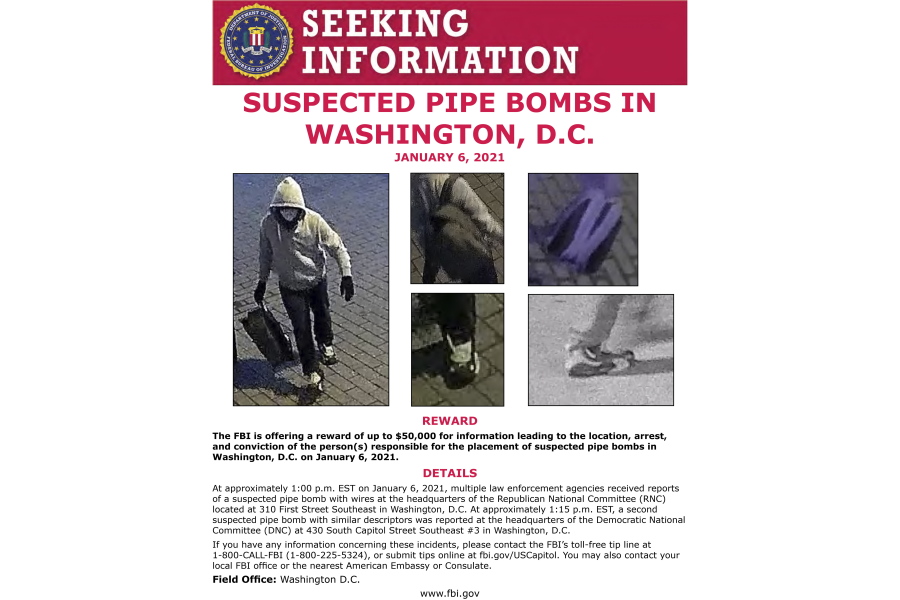This image from an FBI poster seeking a suspect who allegedly placed pipe bombs in Washington on Jan. 6, 2021. Just before the U.S. Capitol was stormed by a sea of pro-Trump rioters the pipe bombs discovered. It quickly became one of the highest-priority investigations for the FBI and the Justice Department. Now, a year later, federal investigators are no closer to learning the person's identity.  And a key question remains: was there a connection between the pipe bombs and the riot at the Capitol?