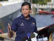 U.S. Coast Guard Captain Jo-Ann F. Burdian details the search of 38 missing migrants at a news conference, Wednesday, Jan. 26, 2022, in Miami Beach, Fla. One migrant was found clinging to the hull of an overturn vessel and one body was recovered off the coast of Fort Pierce, Fla. The migrants left the Bahamas on Saturday in what the Coast Guard suspects is a human smuggling operation.