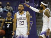 Washington guard Terrell Brown Jr. (23) reacts with guard PJ Fuller, right, after making a basket against Colorado during the second half of an NCAA college basketball game, Thursday, Jan. 27, 2022, in Seattle. Washington won 60-58. (AP Photo/Ted S.