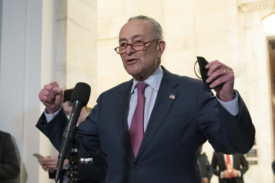 FILE - Senate Majority Leader Chuck Schumer, D-NY, speaks to the media after Senate Democrats met privately with President Joe Biden, Jan. 13, 2022, on Capitol Hill in Washington.