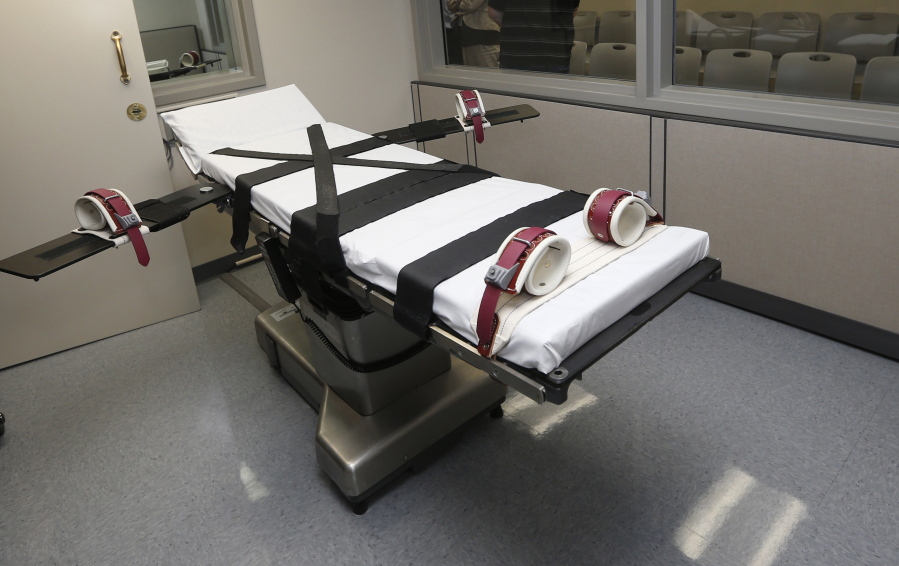 FILE - This Oct. 9, 2014, file photo shows the gurney in the the execution chamber at the Oklahoma State Penitentiary in McAlester, Okla. Two Oklahoma death row inmates facing executions in the coming months offered firing squad as a less problematic alternative to the state's three-drug lethal injection, one of their attorneys told a federal judge on Monday, Jan. 10, 2022.