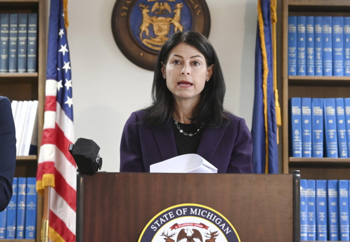 FILE - Attorney General Dana Nessel announces charges for several security guards from Northland Mall in the 2014 death of McKenzie Cochran during a news conference in Detroit on Thursday, Oct. 14, 2021.  Nessel is asking federal prosecutors, Thursday, Jan. 13, 2022,  to open a criminal investigation into 16 Republicans who submitted false certificates stating they were the state's presidential electors despite Joe Biden's 154,000-vote victory in 2020.