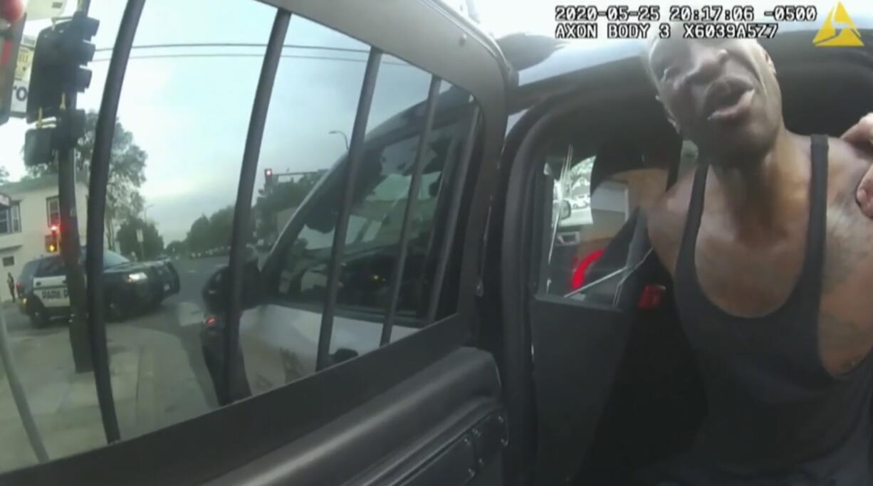 FILE In this image from police body cam video, Minneapolis police officers attempt to place George Floyd in a police vehicle, on May 25, 2020, outside Cup Foods in Minneapolis. Prosecutors played videos from the scene of Floyd's arrest Tuesday, Jan. 25, 2022 at the federal civil rights trial of three former Minneapolis police officers accused of violating Floyd's civil rights as fellow Officer Derek Chauvin killed him.