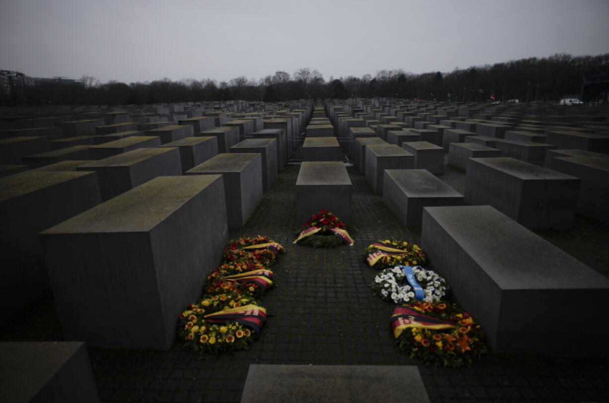 Wreaths placed at the Memorial to the Murdered Jews of Europe on the International Holocaust Remembrance Day in Berlin, Germany, Thursday, Jan. 27, 2022. The International Holocaust Remembrance Day marking the anniversary of the liberation of the Nazi dear camp Auschwitz on Jan. 27, 1945.