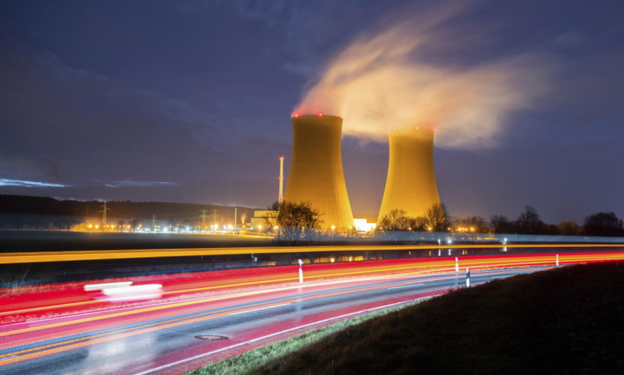 Steam rises from the cooling towers of the Grohnde nuclear power plant near Grohnde, Germany, Wednesday, Dec. 29, 2021. Germany on Friday, Dec. 31, 2021 is shutting down half of the six nuclear plants it still has in operation, a year before the country draws the final curtain on its decades-long use of atomic power.