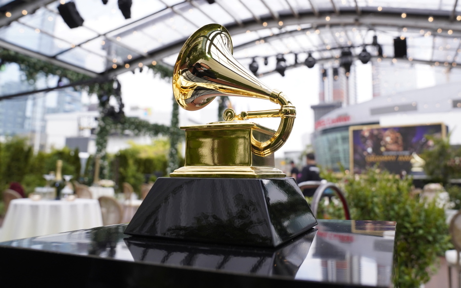 FILE - A decorative grammy is seen before the start of the 63rd annual Grammy Awards at the Los Angeles Convention Center on Sunday, March 14, 2021. The upcoming Grammy Awards have been postponed due to what organizers called "too many risks" due to the omicron variant. The ceremony had been scheduled for Jan. 31st in Los Angeles with a live audience and performances.