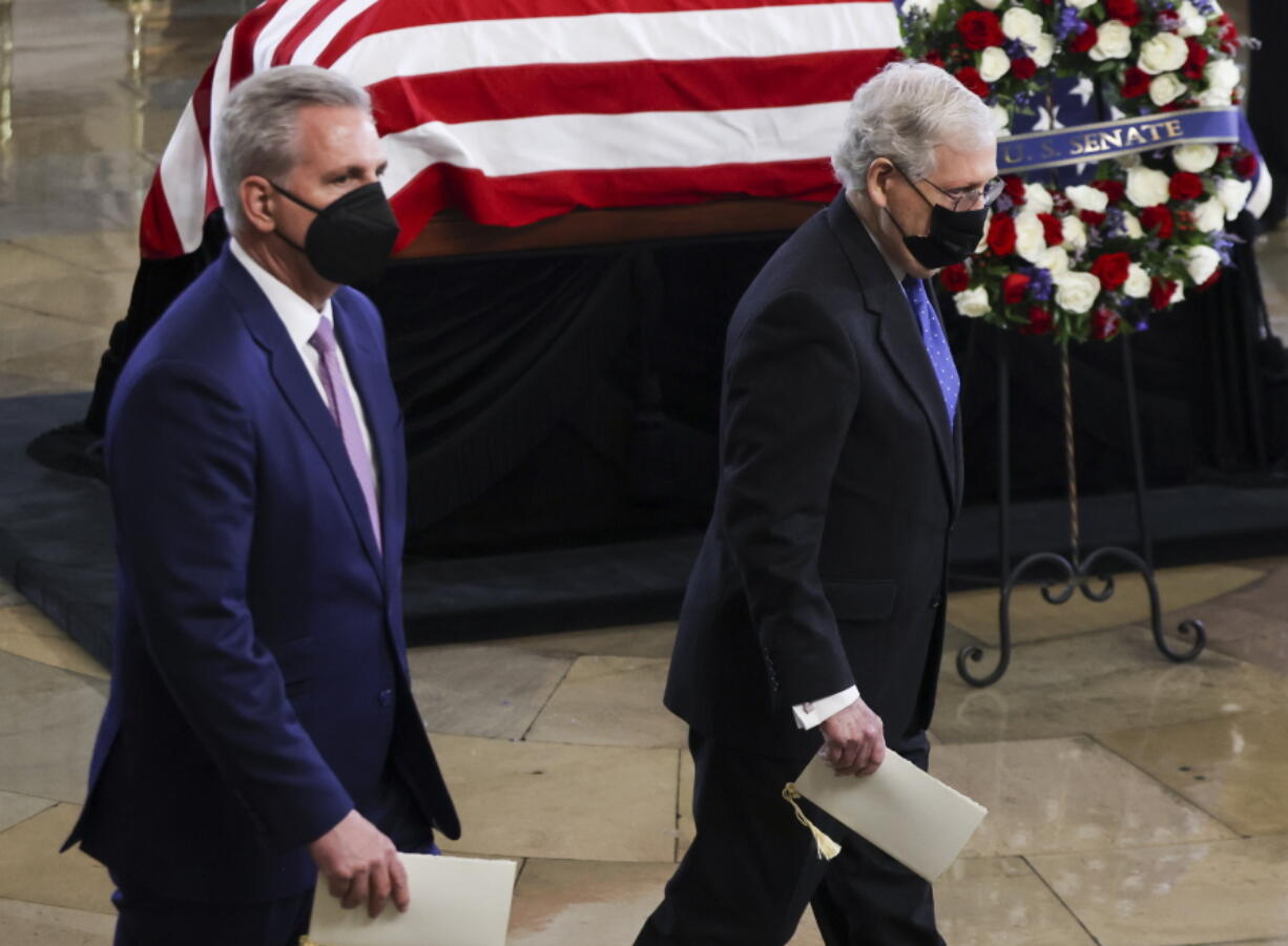 House Minority Leader Kevin McCarthy of Calif. and Senate Minority Leader Mitch McConnell of Ky., right, pay their respects to former Senate Majority Leader Harry Reid, D-Nev., during a memorial service in the Rotunda of the U.S. Capitol as Reid lies in state, Wednesday, Jan. 12, 2022, in Washington.