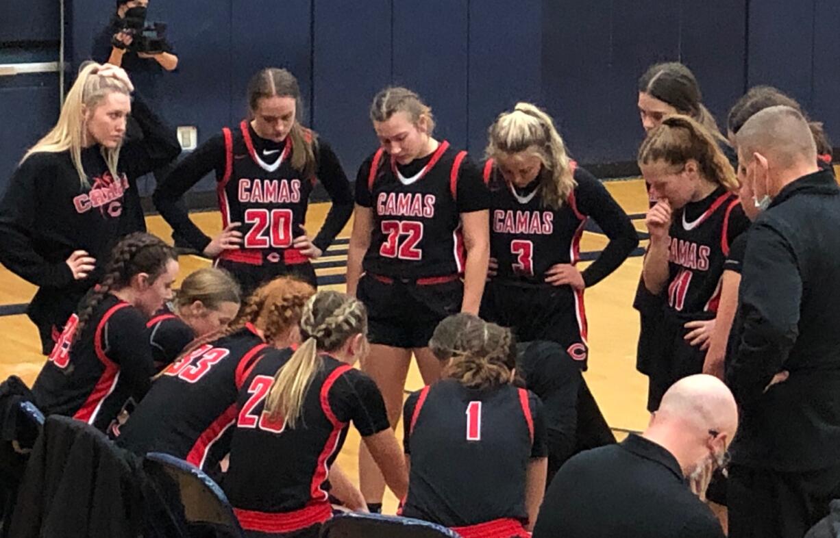 The Camas girls basketball team huddles during a timeout en route to a 60-42 win over Skyview on Friday at Skyview High School.