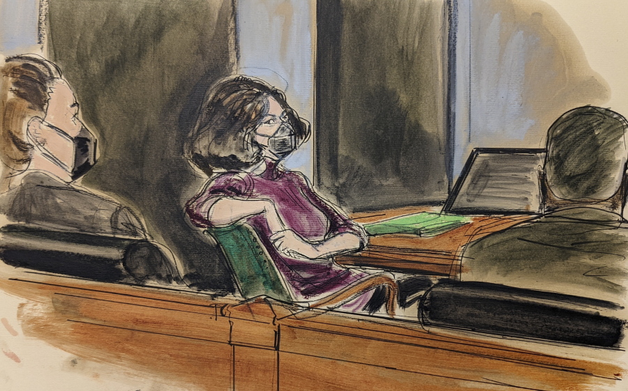 In this courtroom sketch, Ghislaine Maxwell, center, sits in the courtroom during a discussion about a note from the jury, during her sex trafficking trial, Wednesday, Dec. 29, 2021, in New York.