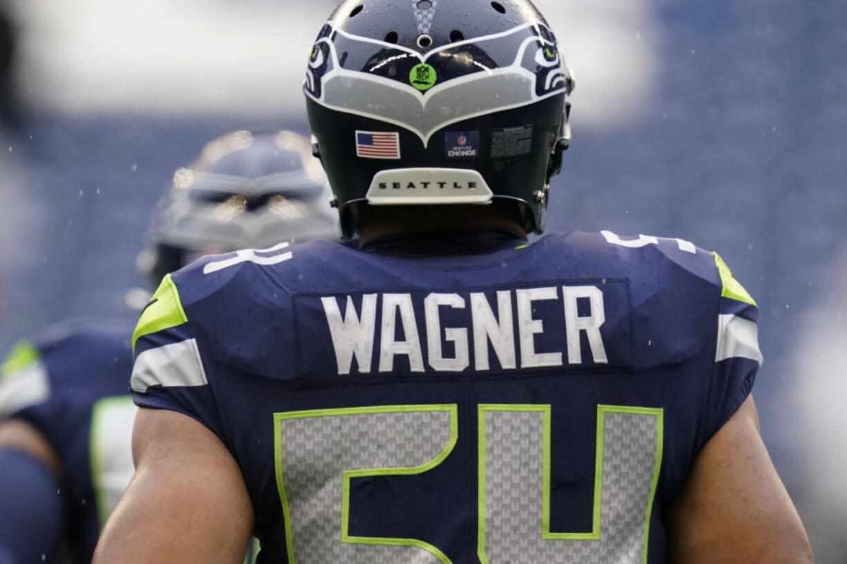Seattle Seahawks linebacker Bobby Wagner stands on the field before an NFL football game against the Detroit Lions, Sunday, Jan. 2, 2022, in Seattle.