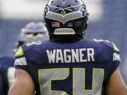 Seattle Seahawks linebacker Bobby Wagner stands on the field before an NFL football game against the Detroit Lions, Sunday, Jan. 2, 2022, in Seattle.