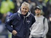 Seattle Seahawks head coach Pete Carroll smiles on the sideline during the second half of an NFL football game against the Detroit Lions, Sunday, Jan. 2, 2022, in Seattle.