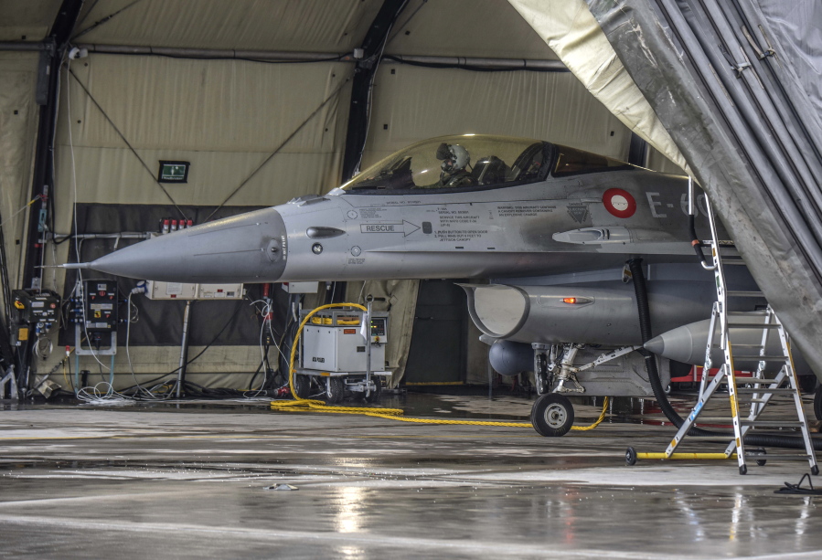 In this photo provided by Lithuanian Ministry of National Defense, a Danish Royal Air Force F-16 fighter jet stand on the tarmac after landing at the Siauliai airbase, some 230 km (144 miles) east of the capital Vilnius, Lithuania, Thursday, Jan. 27, 2022. As tensions build with Russia, NATO is focused on defending its 30 member countries. The world's biggest military organization doesn't do sanctions; it does security. That means deterring any attempt to destabilize members on its eastern flank like Estonia, Latvia, Lithuania and Poland. NATO stands ready to beef up its defenses there should Russia invade Ukraine.