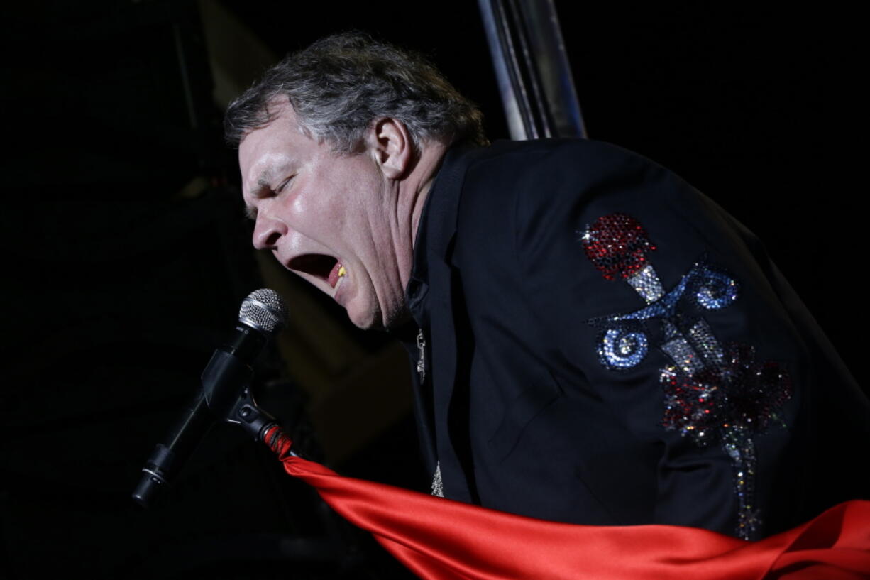 FILE - Singer Meat Loaf performs in support of Republican presidential candidate and former Massachusetts Gov. Mitt Romney at the football stadium at Defiance High School in Defiance, Ohio, Thursday, Oct. 25, 2012. Meat Loaf, whose "Bat Out Of Hell" album is one of the all time bestsellers, has died, family said on Facebook, Friday, Jan. 21, 2022.