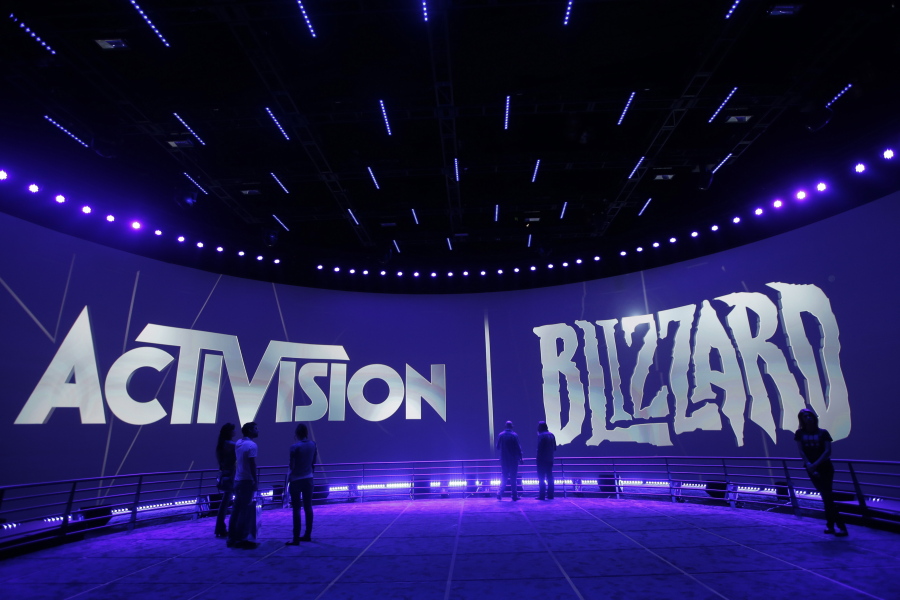 FILE - The Activision Blizzard Booth is shown on June 13, 2013 the during the Electronic Entertainment Expo in Los Angeles. Microsoft is buying Activision Blizzard, Tuesday, Jan. 18, 2022,  for $68.7 billion to gain access to blockbuster games including Call of Duty and Candy Crush. The all-cash deal will let Microsoft accelerate mobile gaming and provide it building blocks for the metaverse, or a virtual environment.  (AP Photo/Jae C.