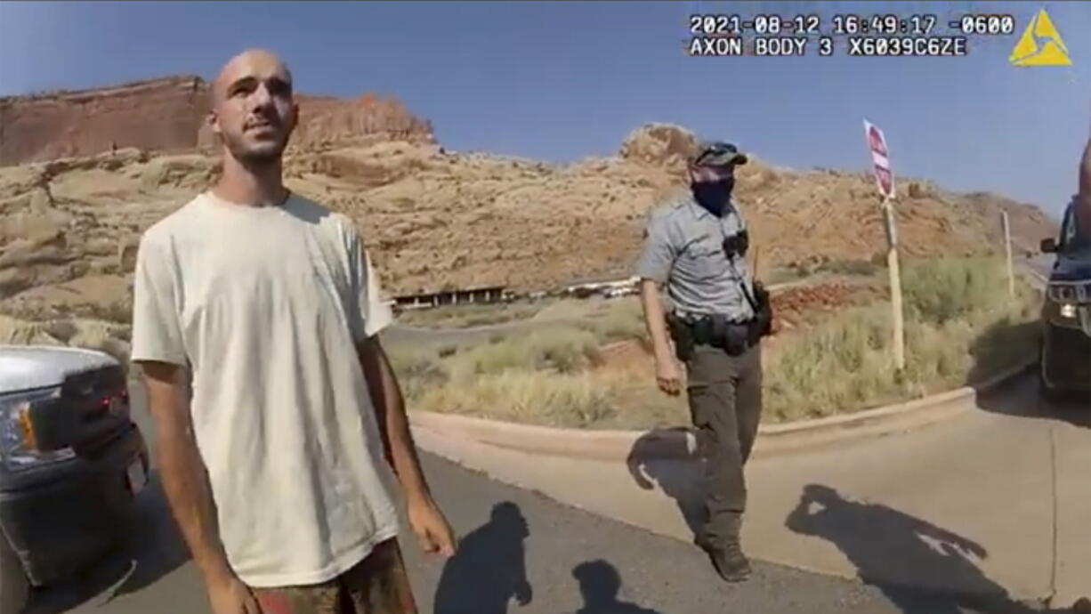 FILE - This Aug. 12, 2021, file photo from video provided by the Moab, Utah, Police Department shows Brian Laundrie talking to a police officer after police pulled over the van he was traveling in with his girlfriend, Gabrielle "Gabby" Petito, near the entrance to Arches National Park in Utah. Laundrie, the boyfriend of slain cross-country traveler Gabby Petito, took responsibility for killing her in a notebook discovered near his body in a Florida swamp, the FBI announced Friday, Jan. 21, 2022.