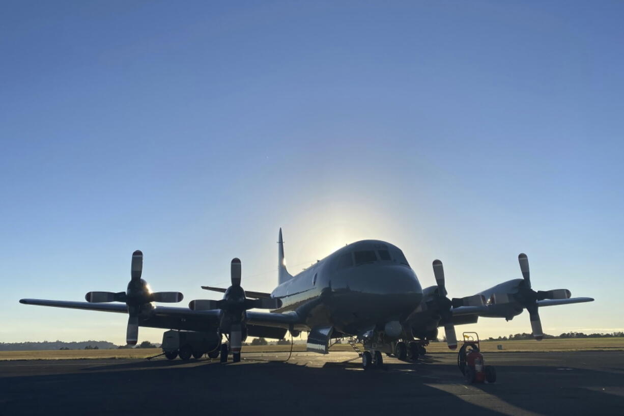 In this photo provided by the New Zealand Defense Force, an Orion aircraft is prepared at a base in Auckland, New Zealand, Monday, Jan. 17, 2022, before flying to assist the Tonga government after the eruption of an undersea volcano.