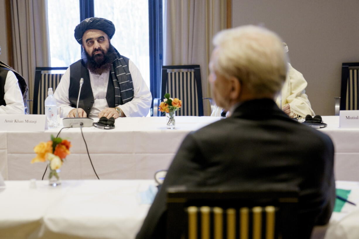Taliban representatives Amir Khan Muttaqi , background, sits opposite  Secretary General of the Norwegian Refugee Council  Jan Egeland, during a meeting at the Soria Moria hotel in Oslo, Tuesday, Jan. 25, 2022. The last day of talks between the Taliban and western diplomats began in Oslo with a bilateral meeting with Norwegian government officials focused largely on the humanitarian situation in Afghanistan. The three-day talks opened on Sunday with talks between the Taliban and members of Afghan civil society, followed on Monday by multilateral talks with western diplomats, the EU, the U.S., Britain, France, Italy and hosts Norway.