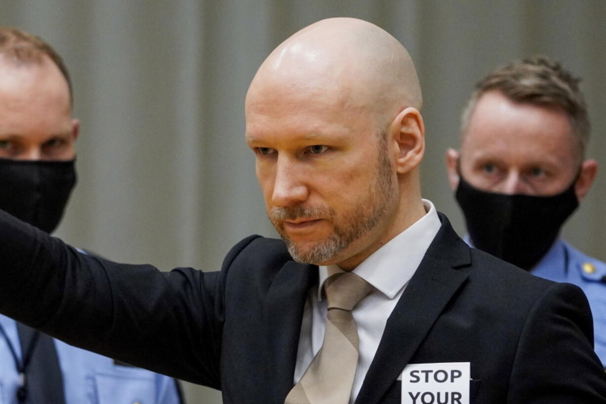 Norwegian mass killer Anders Behring Breivik arrives in court on the first day of a hearing where he is seeking parole, in Skien, Norway, Tuesday, Jan. 18, 2022. Breivik goes to court Tuesday, after 10 years behind bars, claiming he is no longer a danger to society and attempting to get an early release from his 21-year sentence.