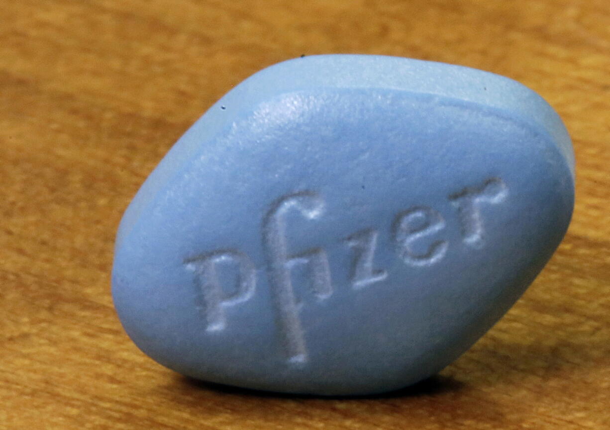 FILE - In this Monday, Dec. 4, 2017, photo, Pfizer's Viagra, is photographed at Pfizer Inc. headquarters in New York.   On Friday, Jan. 14, 2022, The Associated Press reported on stories circulating online incorrectly claiming Viagra can cure COVID-19.