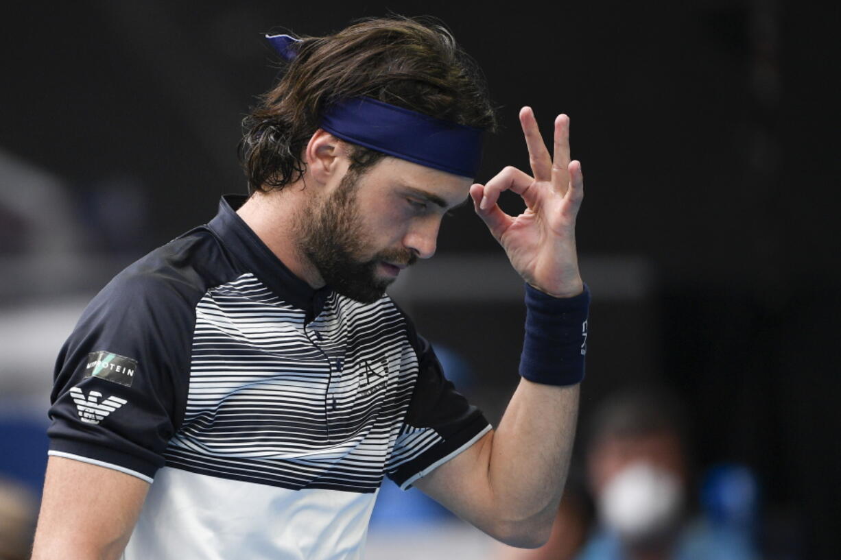 FILE - Nikoloz Basilashvili of Georgia gestures during his first round match against Andy Murray of Britain at the Australian Open tennis championships in Melbourne, Australia, Tuesday, Jan. 18, 2022.  On Friday, Jan.