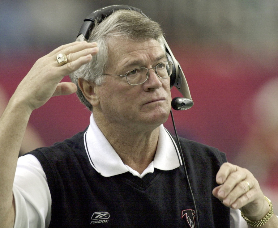FILE - Atlanta Falcons coach Dan Reeves adjusts his headset at the start of play against the Detroit Lions at the Georgia Dome in Atlanta Sunday, Dec. 22, 2002.  Reeves, who won a Super Bowl as a player with the Dallas Cowboys but was best known for a long coaching career highlighted by four more appearances in the title game with the Denver Broncos and Atlanta Falcons, died Saturday, Jan. 1, 2022.