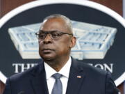 FILE - Secretary of Defense Lloyd Austin pauses while speaking during a media briefing at the Pentagon, Nov. 17, 2021, in Washington. Austin on Thursday, Jan. 27, 2022, ordered his staff to quickly develop an "action plan" for improving how the Pentagon limits and responds to civilian casualties caused by American airstrikes. He called protection of civilians vital to U.S.