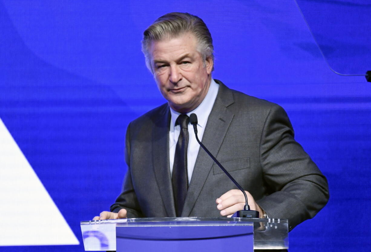 FILE - Alec Baldwin performs emcee duties at the Robert F. Kennedy Human Rights Ripple of Hope Award Gala at New York Hilton Midtown on Dec. 9, 2021, in New York. Baldwin said Saturday, Jan. 8, 2022, any suggestion that he's not cooperating with a probe into last fall's shooting on his movie set that killed cinematographer Halyna Hutchins is a lie. He responded via Instagram to stories that discussed why authorities who served him with a search warrant for his phone haven't gotten it yet.