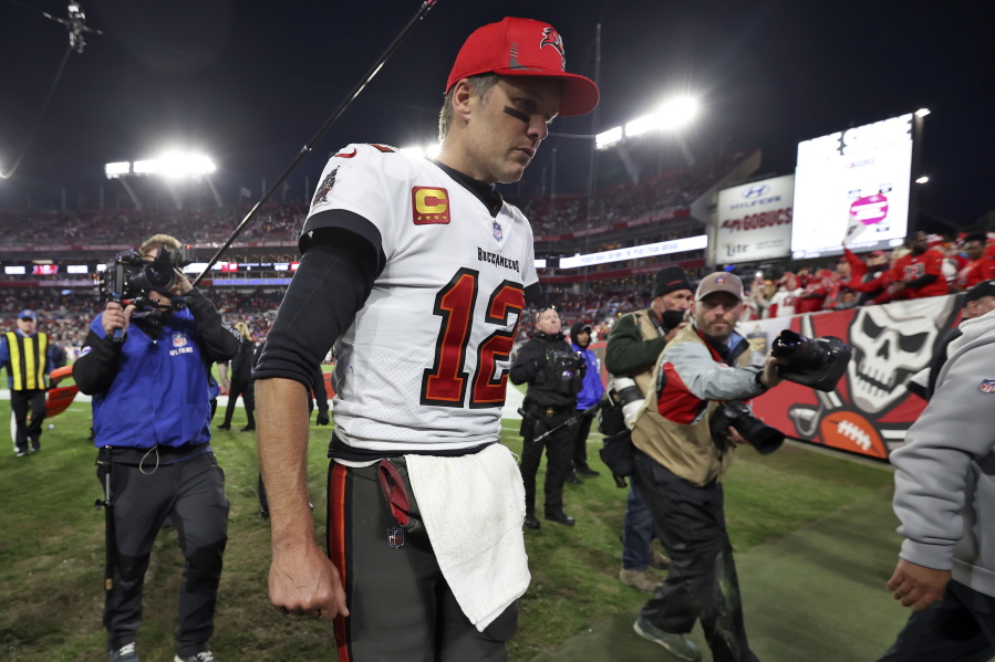 Tampa Bay Buccaneers quarterback Tom Brady (12) reacts as he leaves the field after the team lost to the Los Angeles Rams during an NFL divisional round playoff football game Sunday, Jan. 23, 2022, in Tampa, Fla.