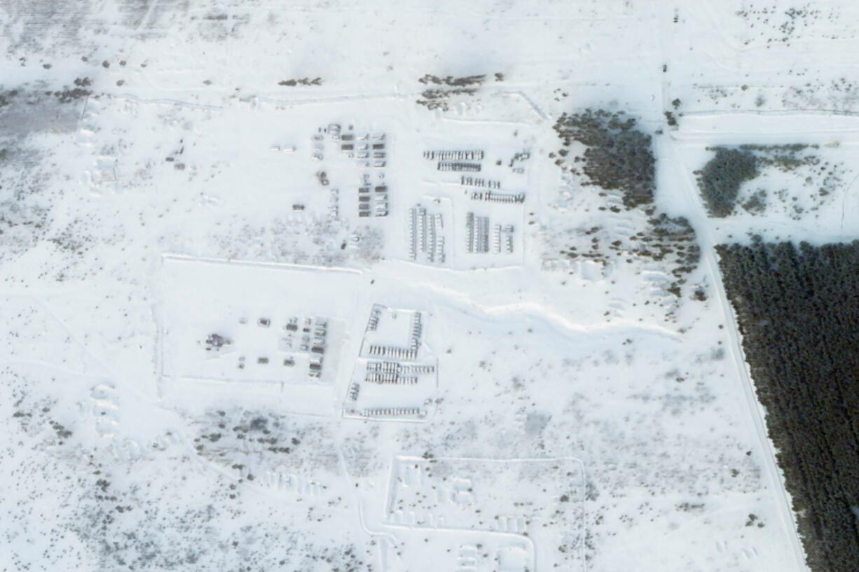 This satellite image provided by Planet Labs PBC shows vehicles and tanks stationed at the Pogonovo training area just south of the city of Voronezh, Russia, Wednesday, Jan. 26, 2022. Russia warned Wednesday it would quickly take "retaliatory measures" if the U.S. and its allies reject its security demands over NATO and Ukraine, raising pressure on the West amid concerns that Moscow is planning to invade its neighbor.