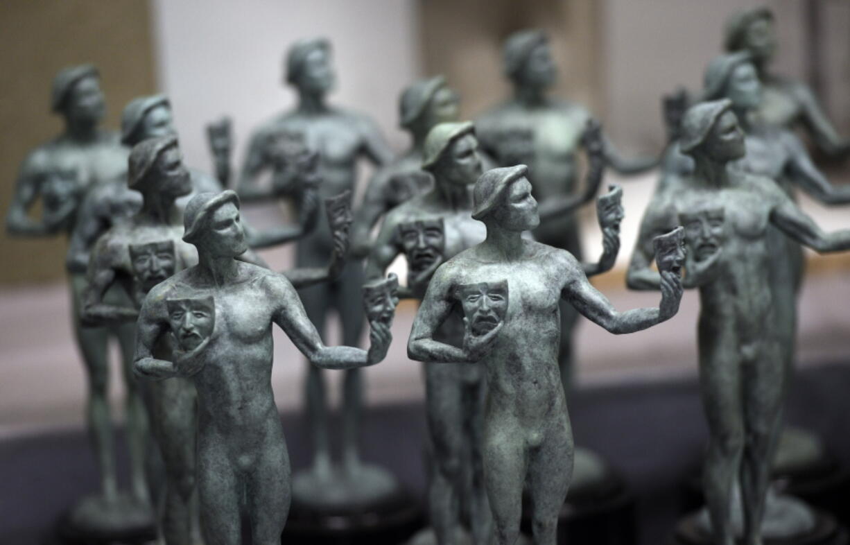 FILE - Finished solid bronze Actor statuettes are displayed during the 25th Annual Casting of the Screen Actors Guild Awards at American Fine Arts Foundry, Tuesday, Jan. 15, 2019, in Burbank, Calif.  The 2022 SAG Awards are scheduled to take place on Feb. 27.