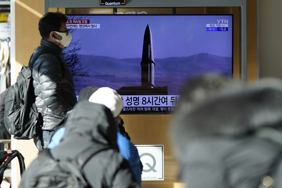 People watch a TV screen showing a news program reporting about North Korea's missile launch with a file image, at a train station in Seoul, South Korea, Monday, Jan. 17, 2022. North Korea on Monday fired two suspected ballistic missiles into the sea in its fourth weapons launch this month, South Korea's military said, with the apparent goal of demonstrating its military might amid paused diplomacy with the United States and pandemic border closures.