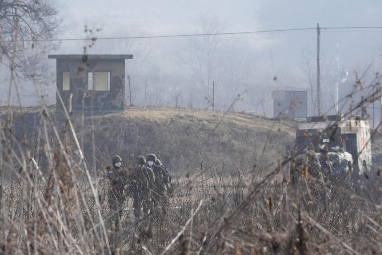 South Korean army soldiers are seen in Paju, near the border with North Korea, South Korea, Thursday, Jan. 27, 2022. North Korea on Thursday fired at least two suspected ballistic missiles into the sea in its sixth round of weapons launches this month, South Korea's military said.