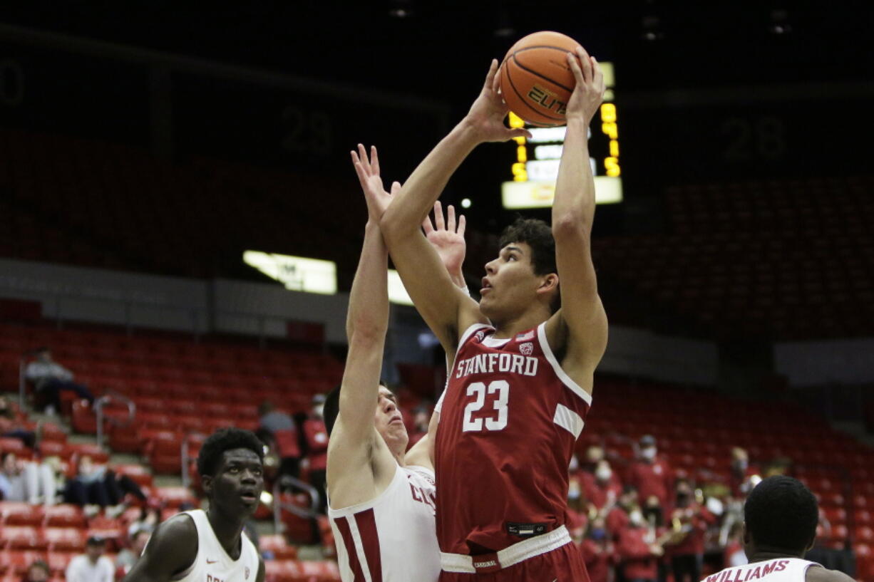 Stanford forward Brandon Angel, right, shoots over Washington State forward Andrej Jakimovski during the first half of an NCAA college basketball game, Thursday, Jan. 13, 2022, in Pullman, Wash.