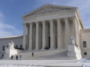 Tourists visit the Supreme Court, Wednesday, Jan., 2022, in Washington.