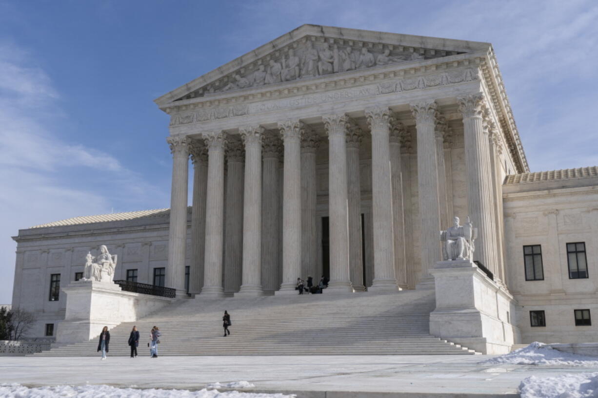 Tourists visit the Supreme Court, Wednesday, Jan., 2022, in Washington.