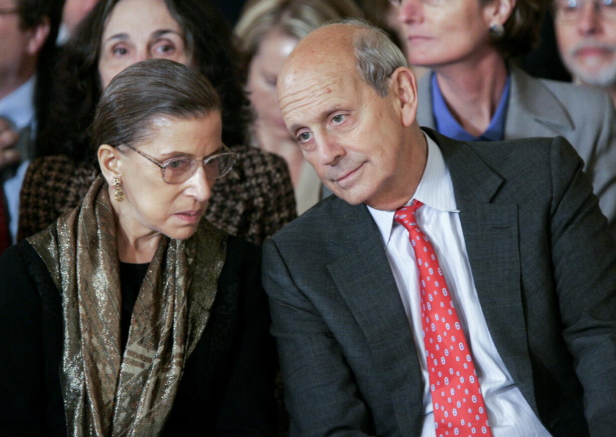 FILE - Supreme Court Associate Justices Ruth Bader Ginsburg, left, and Stephen Breyer talk prior to a ceremonial swearing-in ceremony for new Supreme Court Justice Samuel Alito in the East Room of the White House, Feb. 1, 2006.