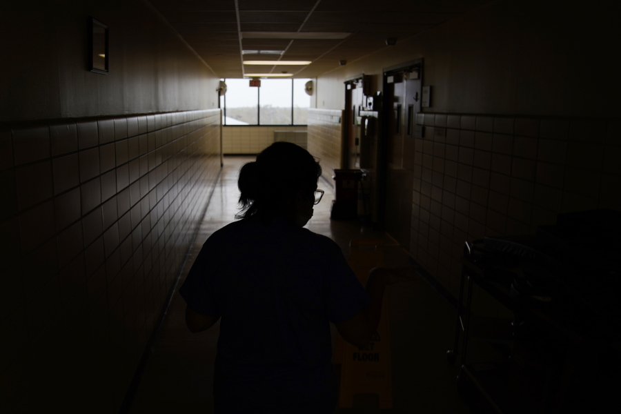 FILE - A chief nursing officer walks down a hallway in the recently reopened emergency room at a hospital  in Houma, La., on Friday, Sept. 3, 2021. Patients worried about getting smacked with an unexpected bill after emergency care gained a layer of protection in January 2022 from a new federal law. The No Surprises Act prevents doctors or hospitals in many situations from billing insured patients higher rates because the care providers are not in their insurer's coverage network.