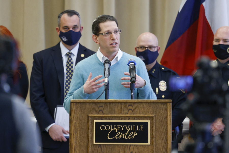Rabbi Charlie Cytron-Walker of Congregation Beth Israel addresses reporters during a news conference at Colleyville Center on Friday, Jan. 21, 2022 in Colleyville, Texas. In the final moments of a 10-hour standoff with a gunman at a Texas synagogue, the remaining hostages and officials trying to negotiate their release took "near simultaneous plans of action," with the hostages escaping as an FBI tactical team moved in, an official said Friday.