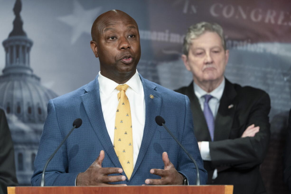 FILE - Sen. Tim Scott, R-S.C., left, speaks during a news conference, Oct. 19, 2021, next to Sen. John Kennedy, R-La., on Capitol Hill in Washington.  The U.S. Senate's only Black Republican is putting forth what he characterizes as a positive response to partisan rhetoric on race that he's best-positioned to rebut. Tim Scott of South Carolina tells The Associated Press that he hopes a video series on issues he sees as pertinent to the Black community will help refocus a fraught national conversation on race. Scott has timed the release in conjunction with Martin Luther King Jr. Day.